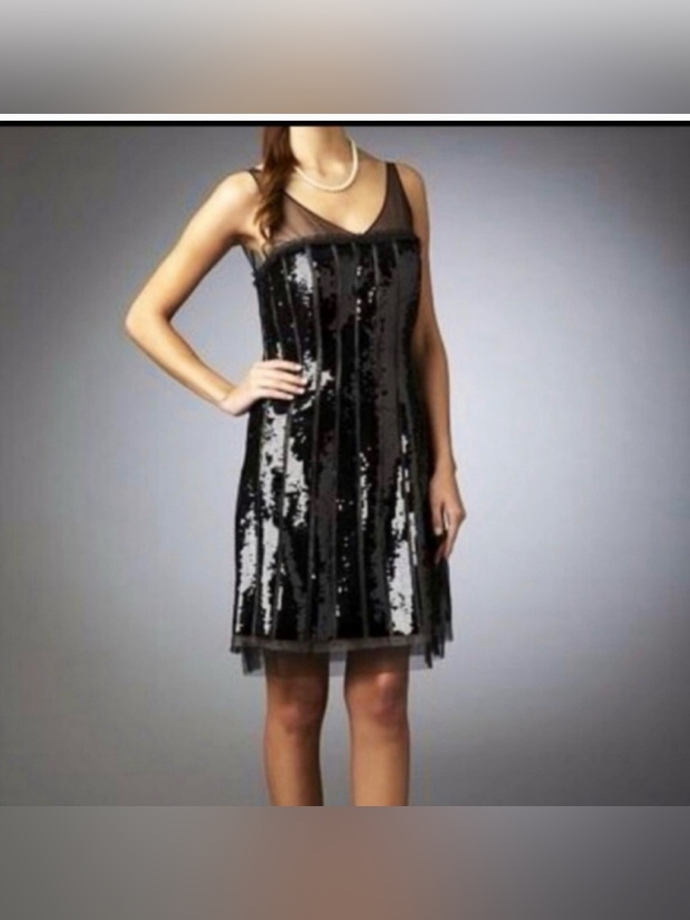 BCBGMaxAzria black sequin mini dress. Vertical stripes and a sheer mesh neckline